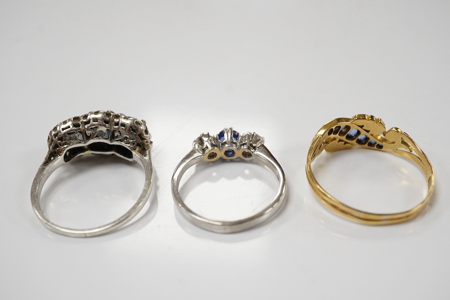 An 18ct white metal, sapphire and diamond set three stone ring, size L and two other sapphire and diamond rings, one late Victorian, gross weight 8.5 grams. Condition - fair to good